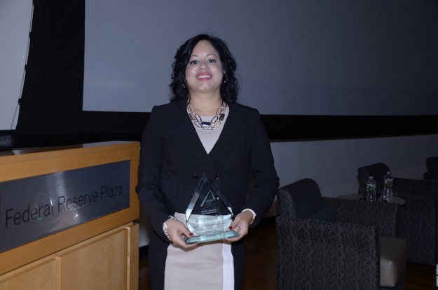 Marcela Aldaz-Matos holds the Diversity, Leadership and Service Award given during the ALPFA Summit.