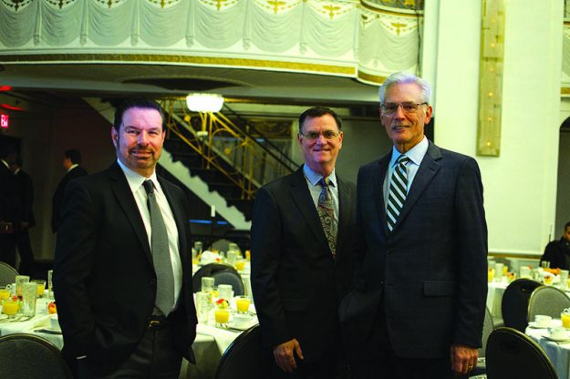 Thomas Croswell, President and CEO Tufts Health Plan (right) enjoying with some friends during the Breakfast.