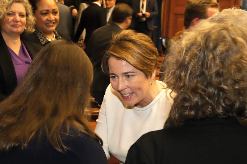 Maura Healey shakes women's hand