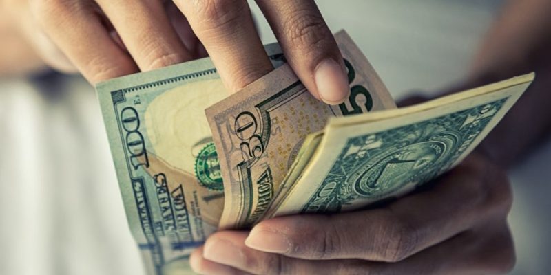 Person counting money
