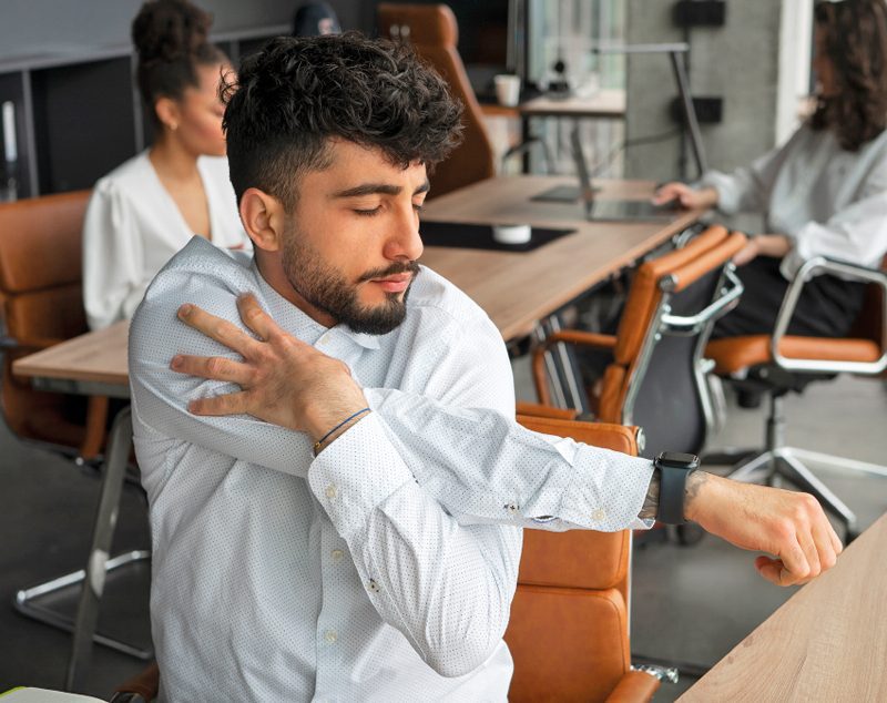 Man stretching at work