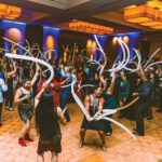 Elena Sicairos, TAG Alumna (arm up), Lindsay Thornquist, TAG Alumna (arms up), Blanca Burgos (Black dress)